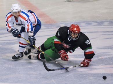 Croatia’s Filip Orescanin and Mexico’s Sebastian Ortega battle for the puck